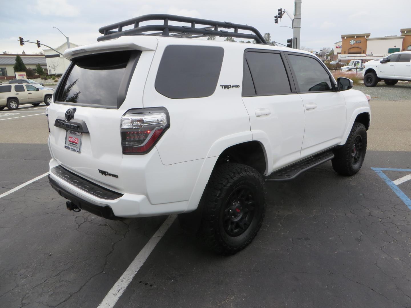 2019 White /BLACK Toyota 4Runner TRD Pro (JTEBU5JR3K5) with an 4.0L V6 engine, 5 -Speed Automatic transmission, located at 2630 Grass Valley Highway, Auburn, CA, 95603, (530) 508-5100, 38.937893, -121.095482 - Features Ironman 4X4 suspension, BFG tires, Rockslider, Roof rack, window tint, and interior Rago Fab Molle storage racks. - Photo#4